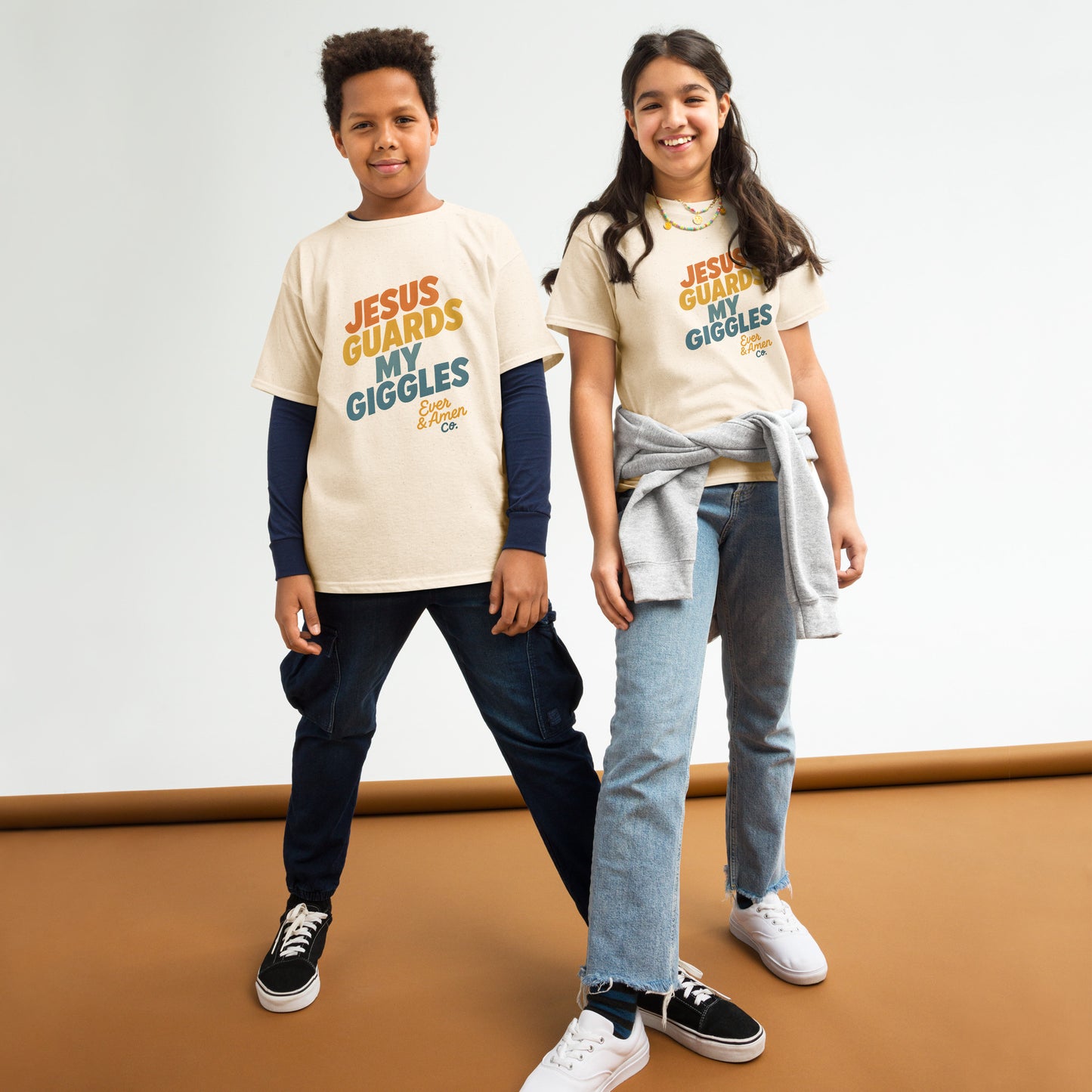 Children’s Christian graphic tee with the phrase “Jesus Guards My Giggles.” Fun and uplifting faith-based shirt reminding kids of God’s love and protection. Perfect for church, school, or everyday play. Created by Ever & Amen Co.