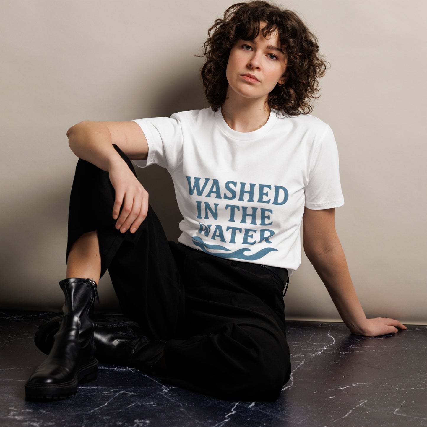 Unisex Christian graphic tee with the phrase “Washed in the Water.” Soft and durable faith-based shirt symbolizing baptism and new life in Christ. Perfect for church, baptisms, or everyday wear. Designed by Ever & Amen Co.
