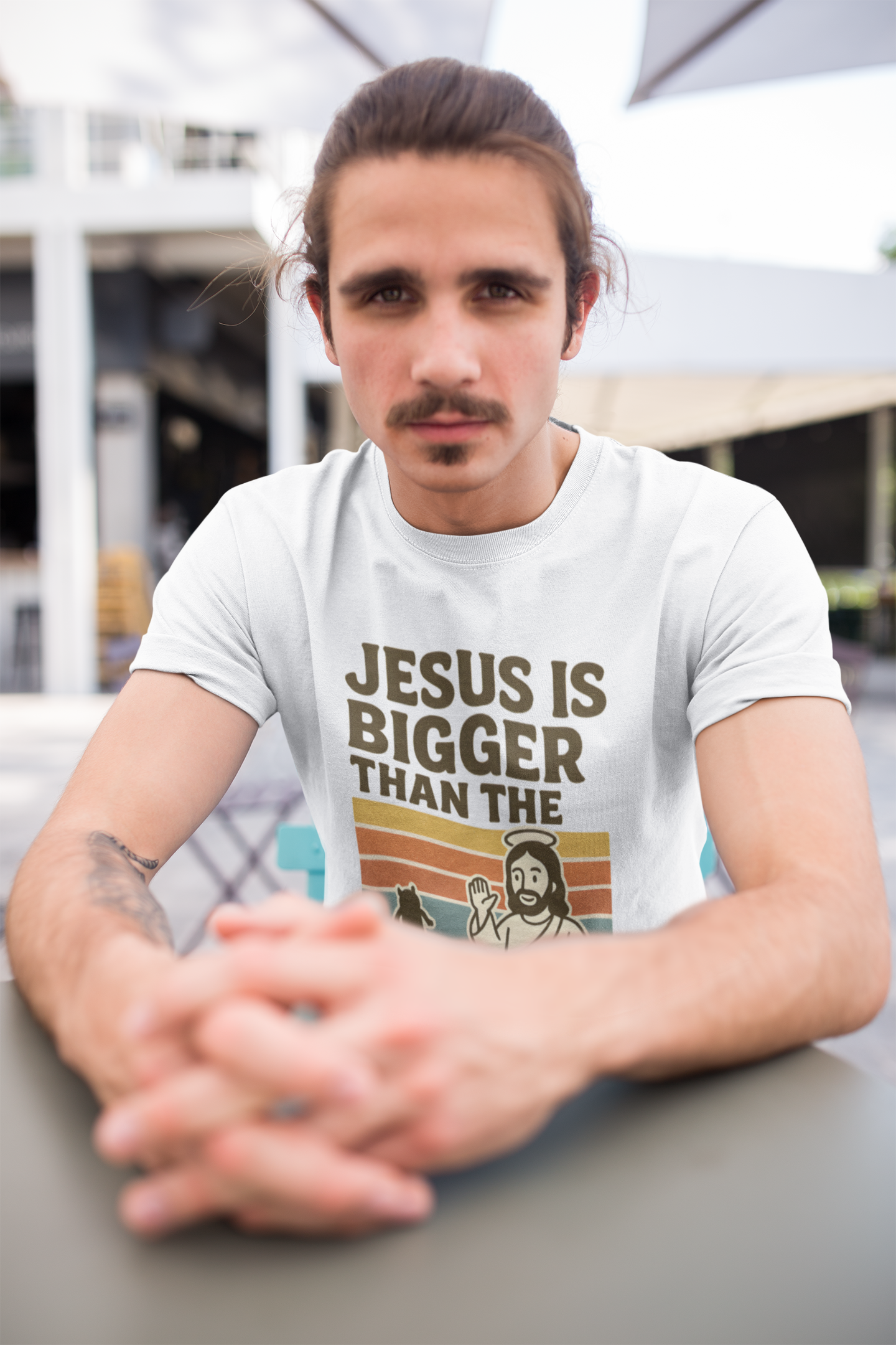 Men’s Christian graphic tee with bold text reading “Jesus Is Bigger Than the Boogeyman.” Modern faith-based shirt perfect for church, everyday wear, or outreach. Designed by Ever & Amen Co. to inspire courage and faith over fear.