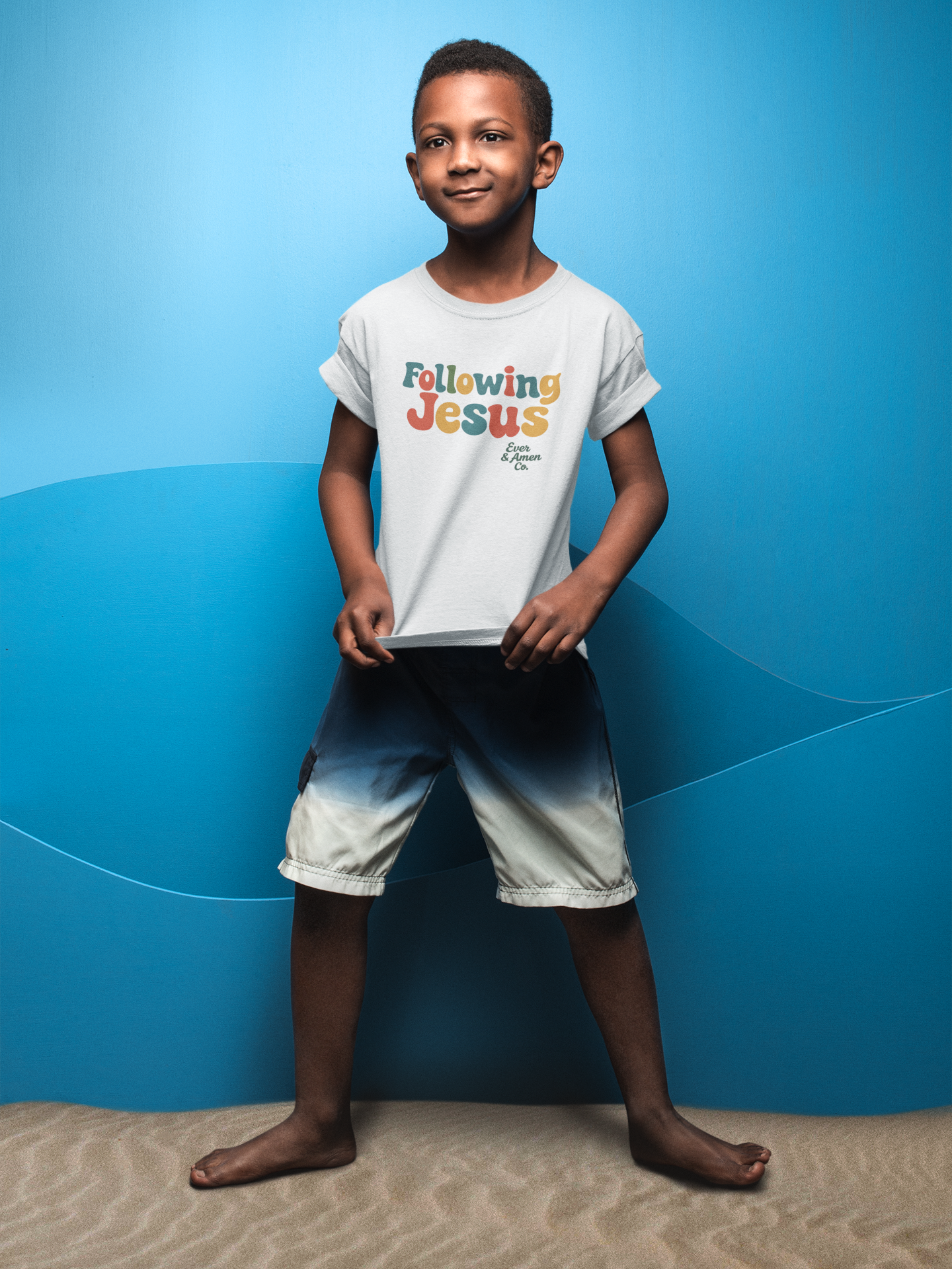 Faith-inspired children’s tee with “Following Jesus” graphic. Soft, unisex Christian apparel for kids.