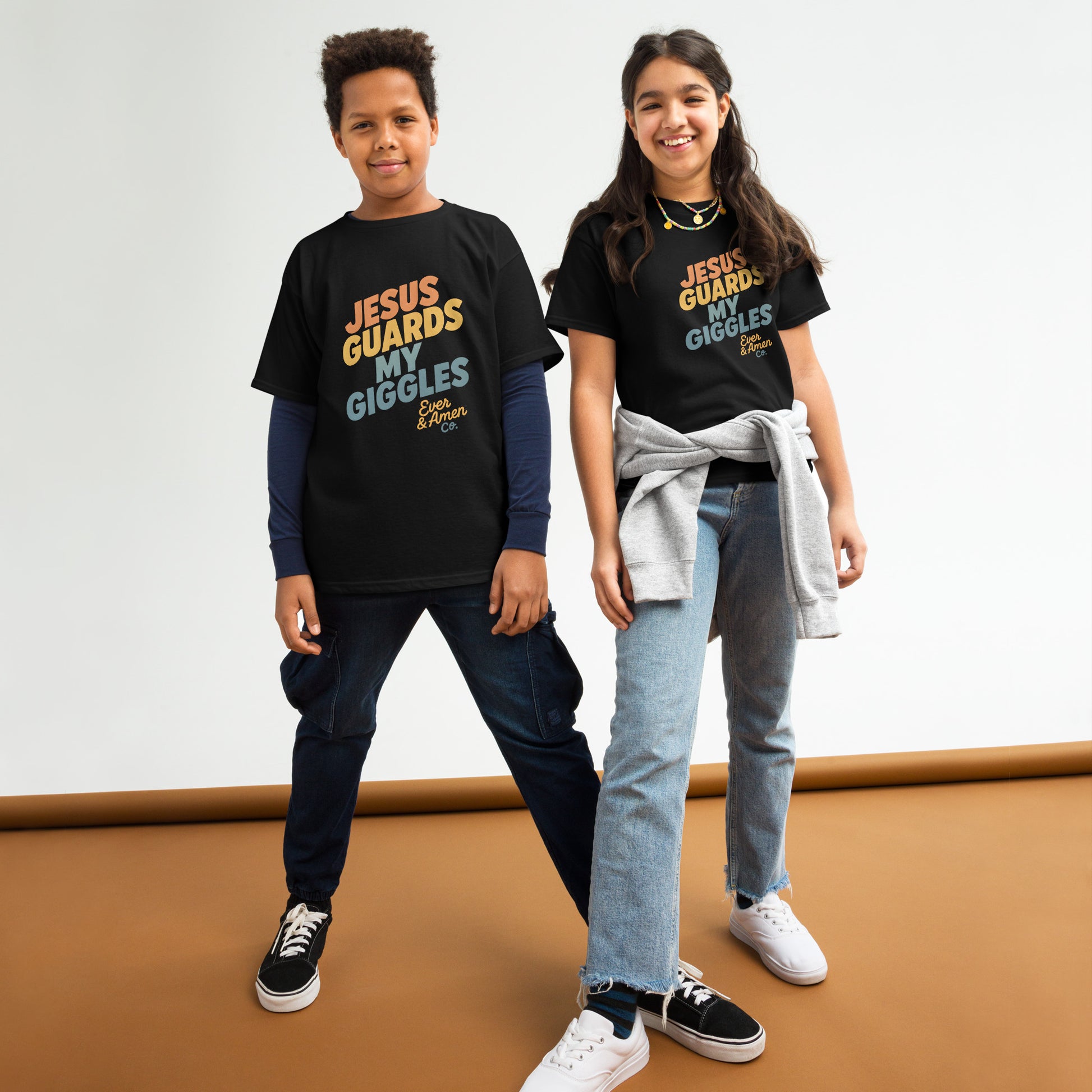 Children’s Christian graphic tee with the phrase “Jesus Guards My Giggles.” Fun and uplifting faith-based shirt reminding kids of God’s love and protection. Perfect for church, school, or everyday play. Created by Ever & Amen Co.
