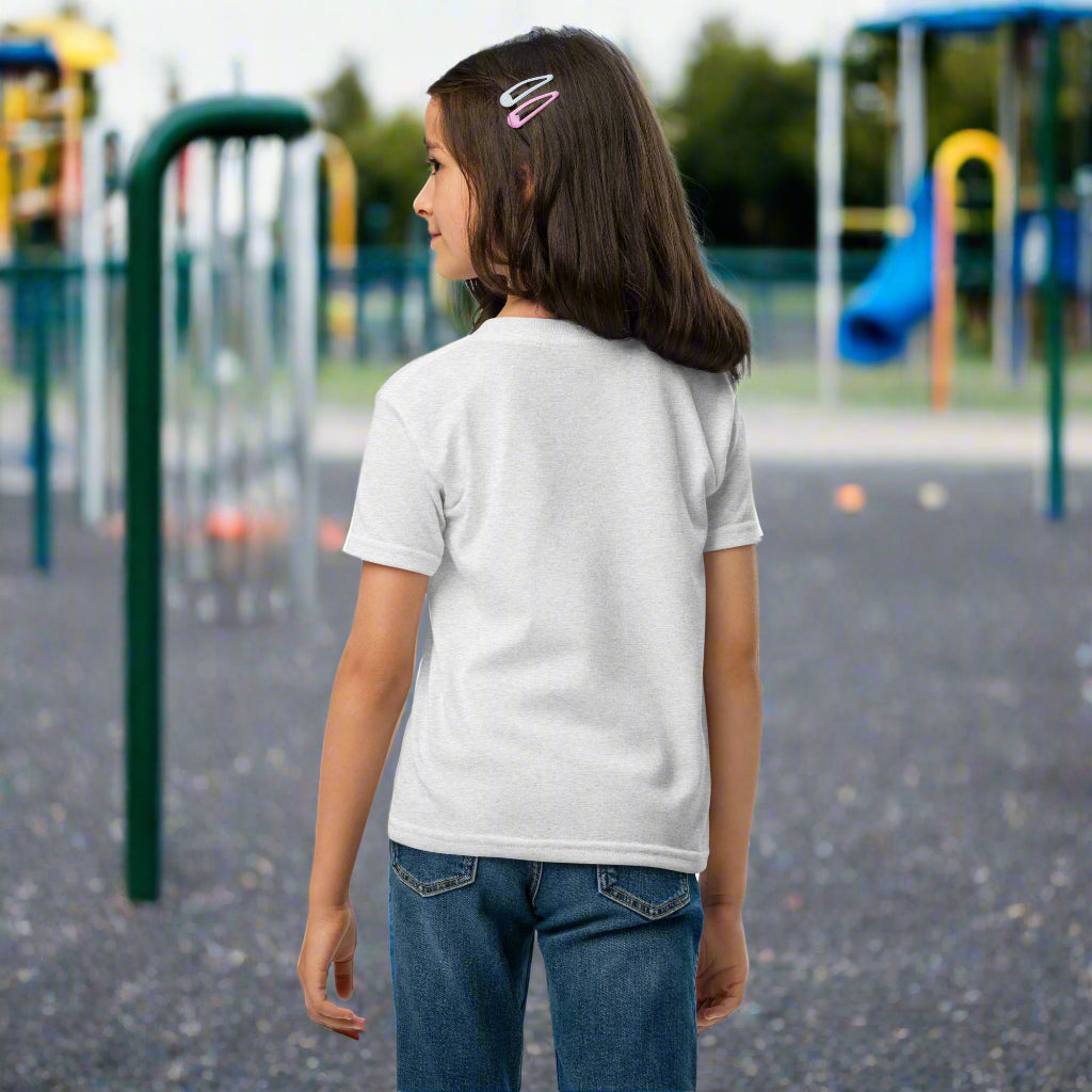 Child wearing a white t-shirt with a logo on the back, standing against a white background