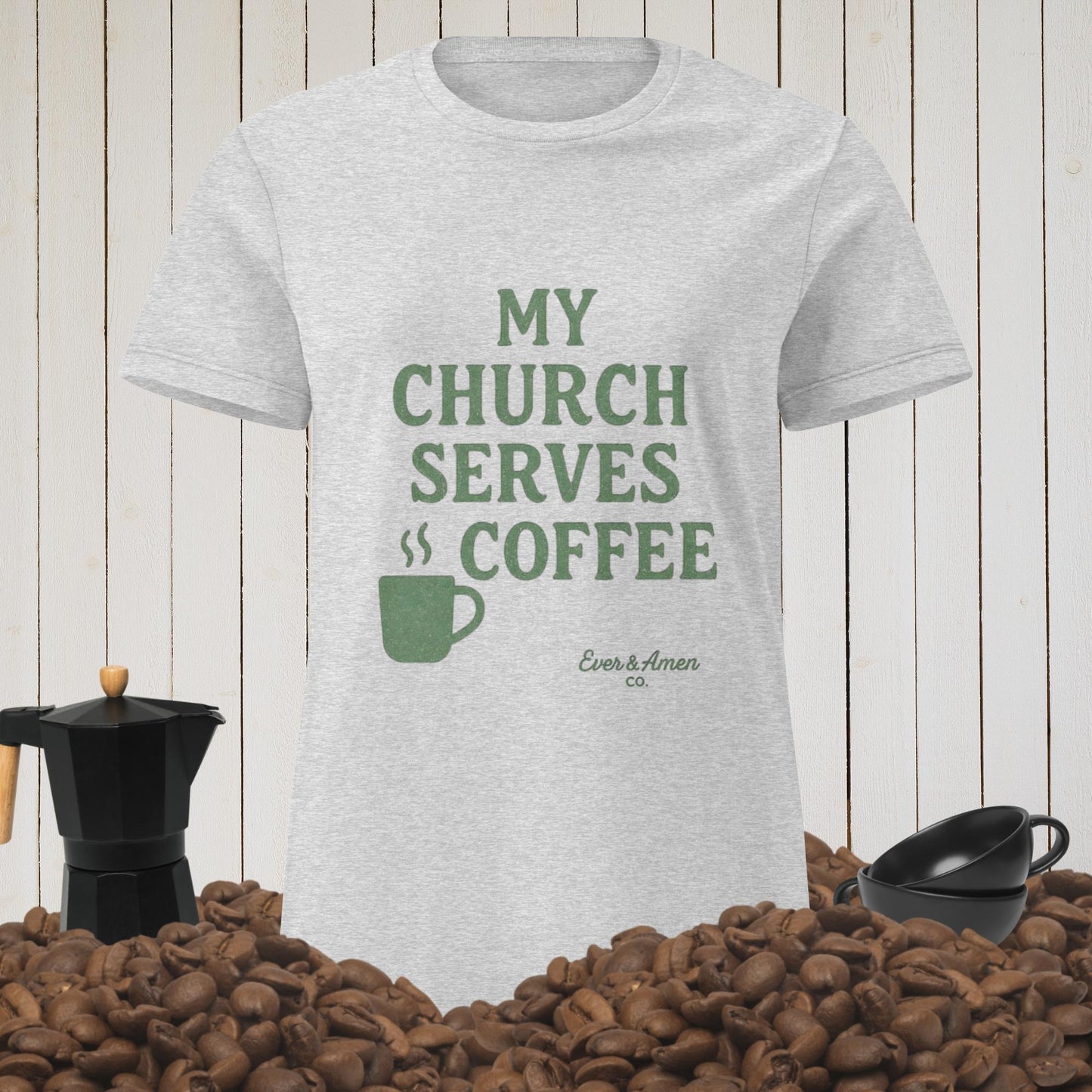 Women’s Christian graphic tee with the phrase “My Church Serves Coffee.” Fun, faith-based shirt perfect for Sunday service, casual wear, or fellowship. Designed by Ever & Amen Co. to blend humor, style, and faith.