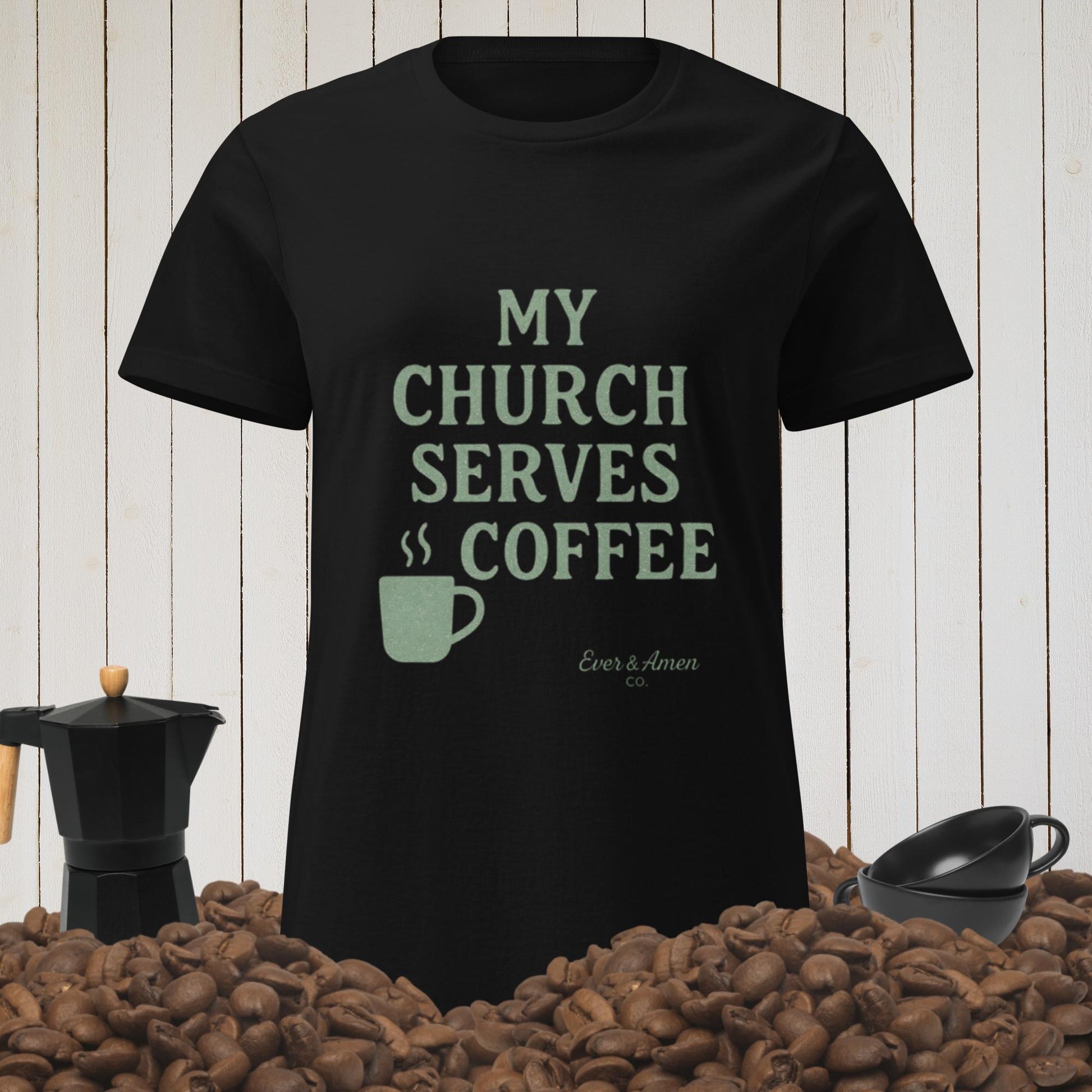 Women’s Christian graphic tee with the phrase “My Church Serves Coffee.” Fun, faith-based shirt perfect for Sunday service, casual wear, or fellowship. Designed by Ever & Amen Co. to blend humor, style, and faith.