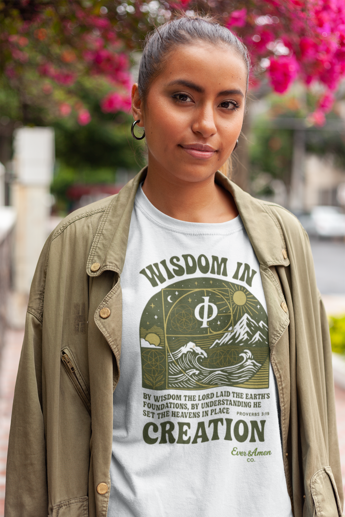 Faith-based oversized tee with sacred geometry and scripture from Proverbs 3:19. Modern Christian design for men and women