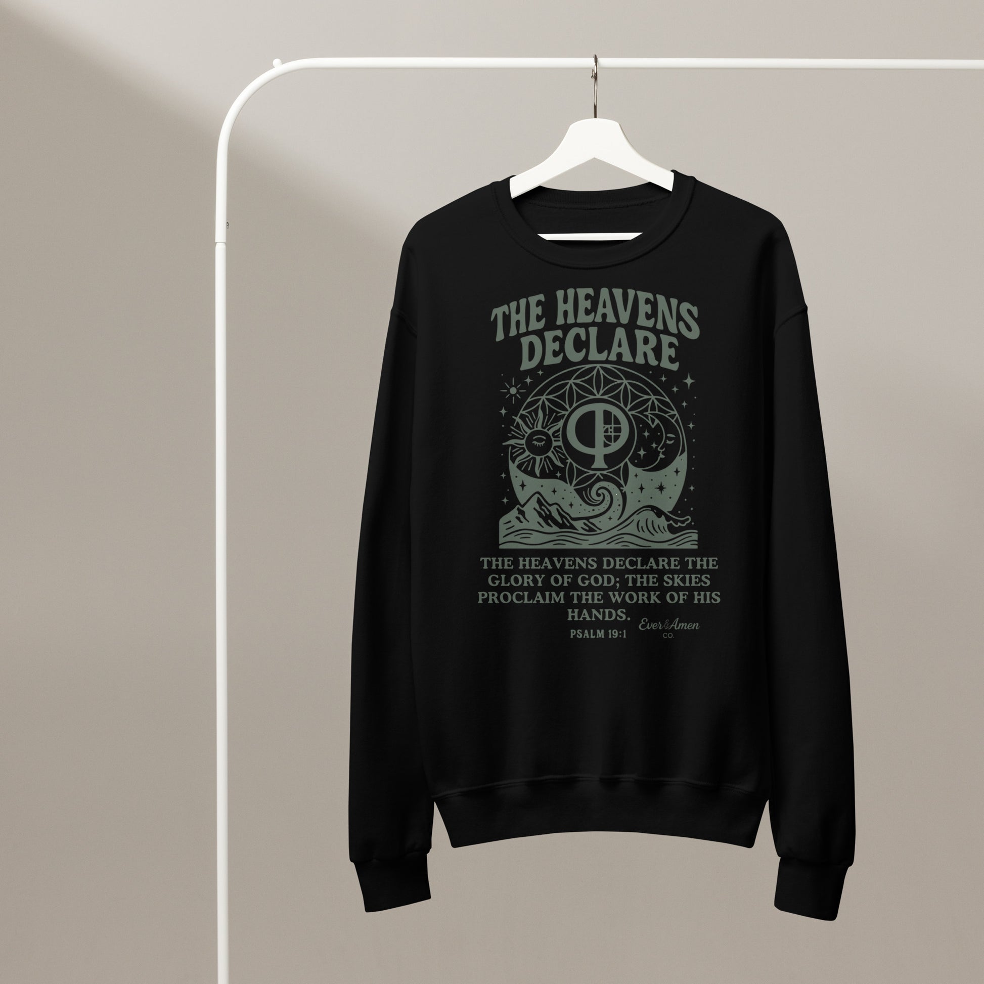Unisex Christian crew neck sweatshirt with the phrase “The Heavens Declare,” inspired by Psalm 19:1 and the golden ratio. Soft, faith-based sweatshirt perfect for church, Bible study, or everyday wear. Designed by Ever & Amen Co