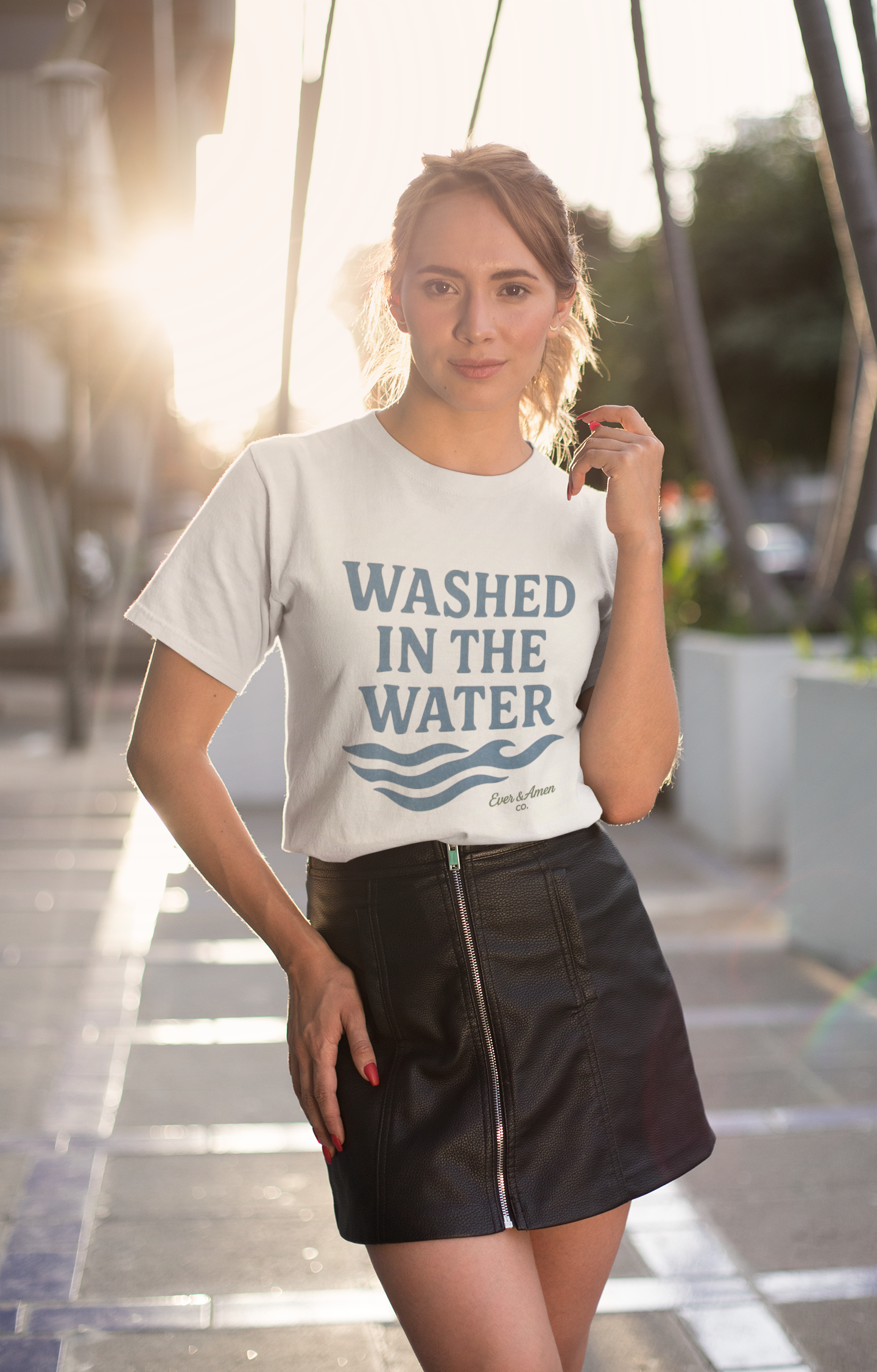 Unisex Christian tee with “Washed in the Water” design, symbolizing baptism and new life in Christ. Faith-based shirt by Ever & Amen Co.