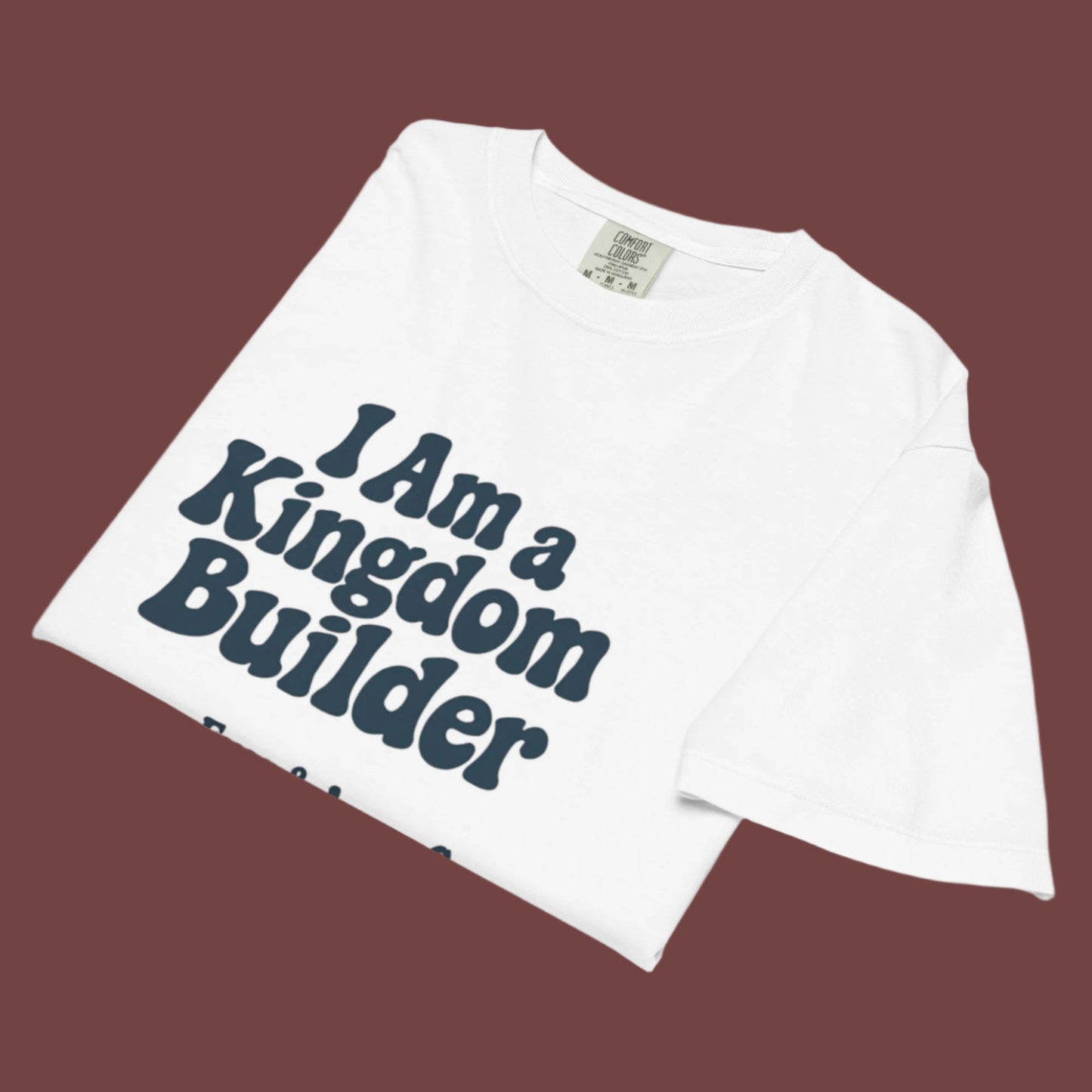 Women’s Christian graphic tee with the phrase “I Am a Kingdom Builder.” Bold and empowering faith-based shirt designed to inspire confidence and purpose. Perfect for church, ministry, or everyday wear. Created by Ever & Amen Co.