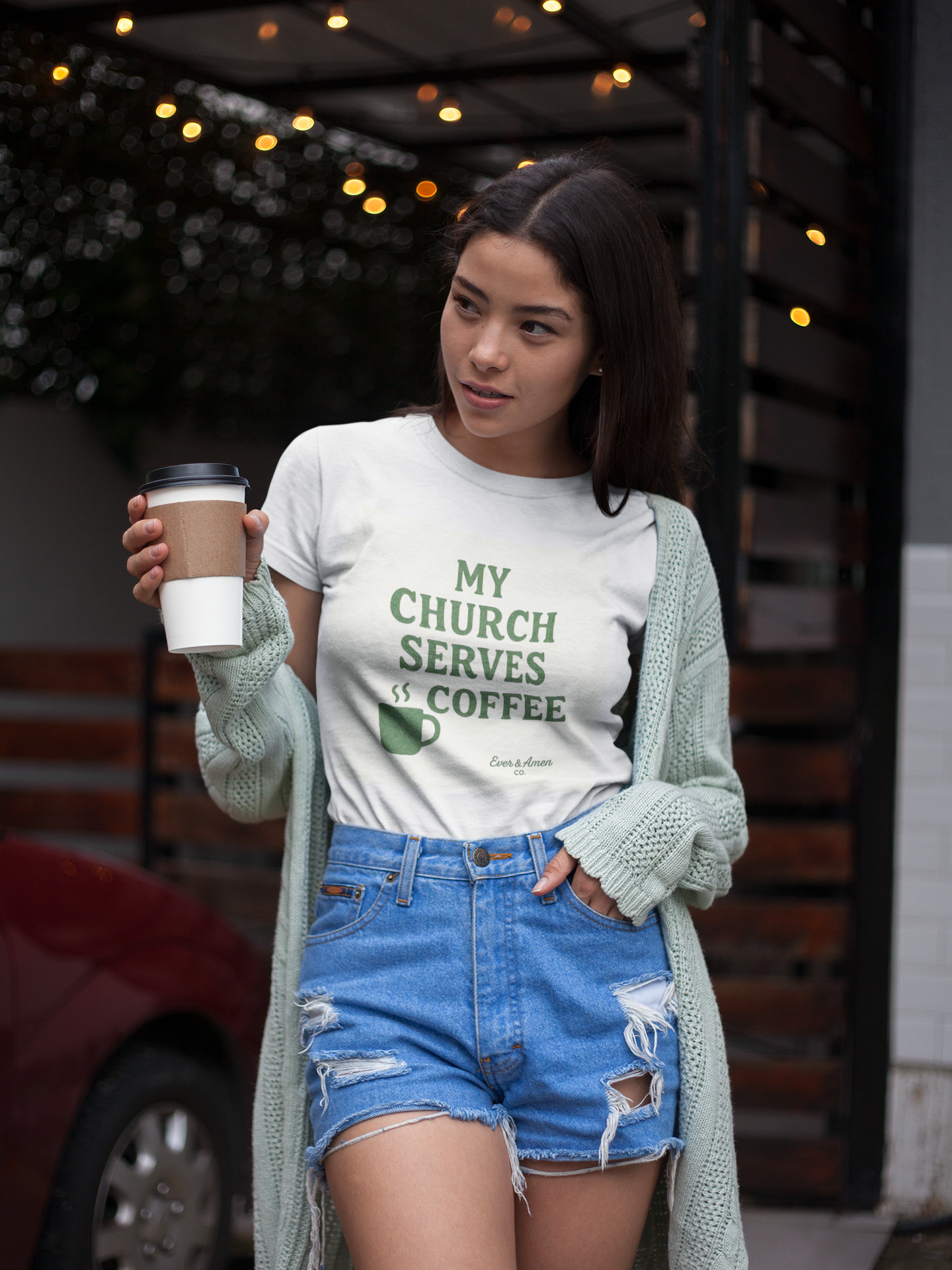 Women’s Christian graphic tee with the phrase “My Church Serves Coffee.” Fun, faith-based shirt perfect for Sunday service, casual wear, or fellowship. Designed by Ever & Amen Co. to blend humor, style, and faith.