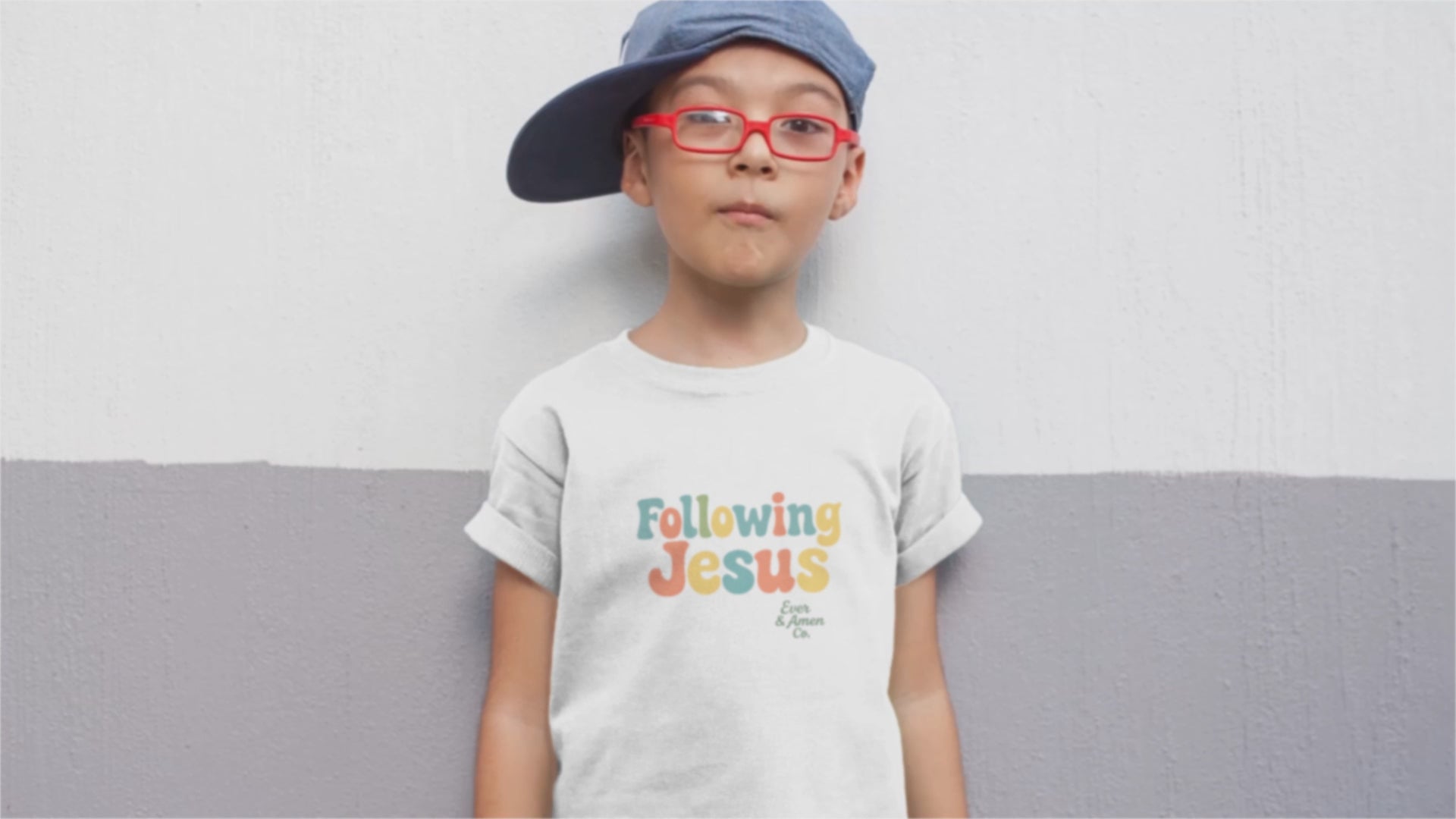 Faith-inspired children’s tee with “Following Jesus” graphic. Soft, unisex Christian apparel for kids.