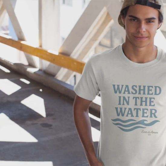 Unisex Christian tee with “Washed in the Water” design, symbolizing baptism and new life in Christ. Faith-based shirt by Ever & Amen Co.