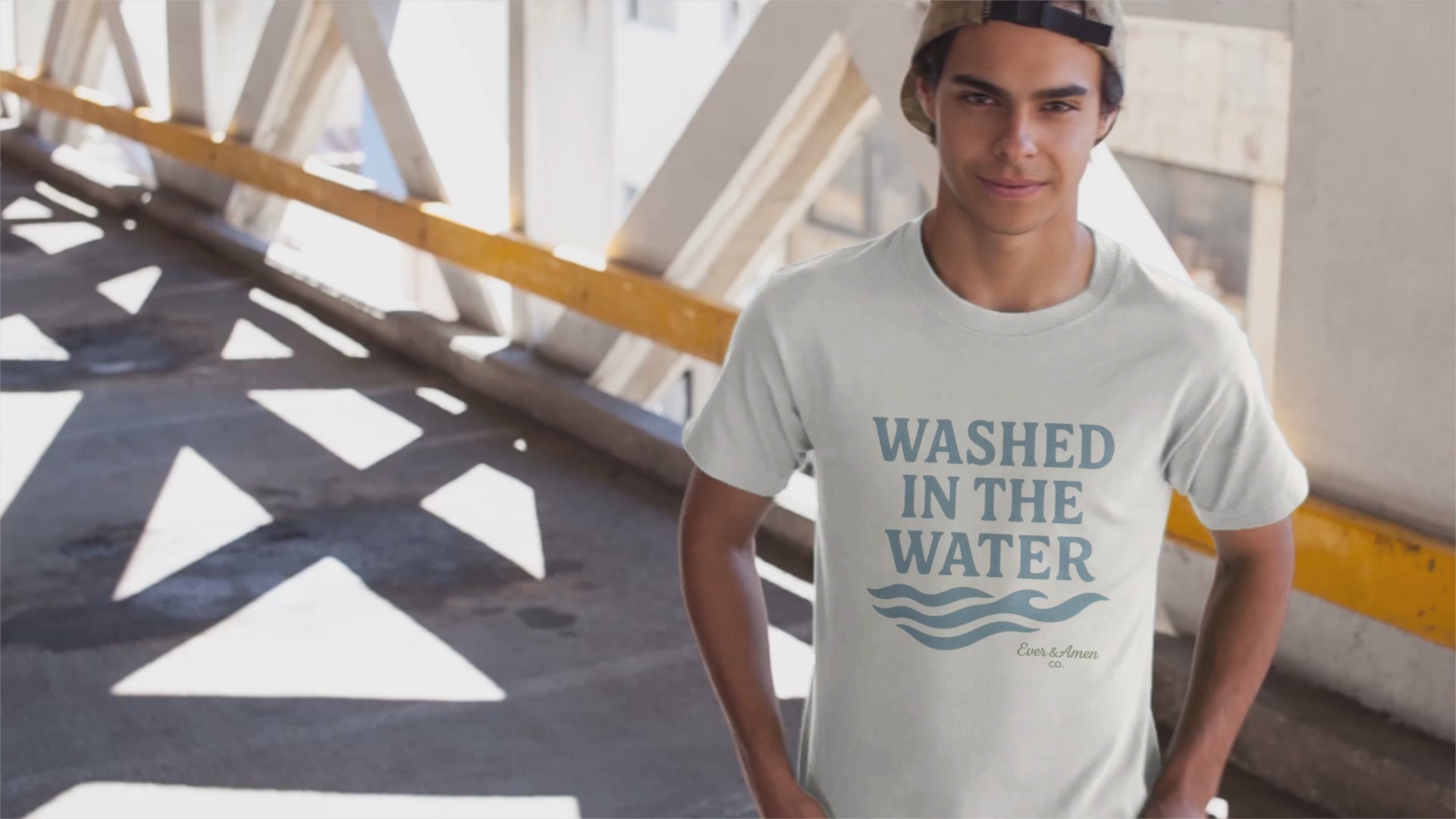 Unisex Christian tee with “Washed in the Water” design, symbolizing baptism and new life in Christ. Faith-based shirt by Ever & Amen Co.