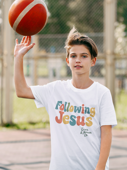Unisex children’s Christian tee with “Following Jesus” design. Soft and faith-filled shirt for boys and girls. Perfect for church or everyday wear