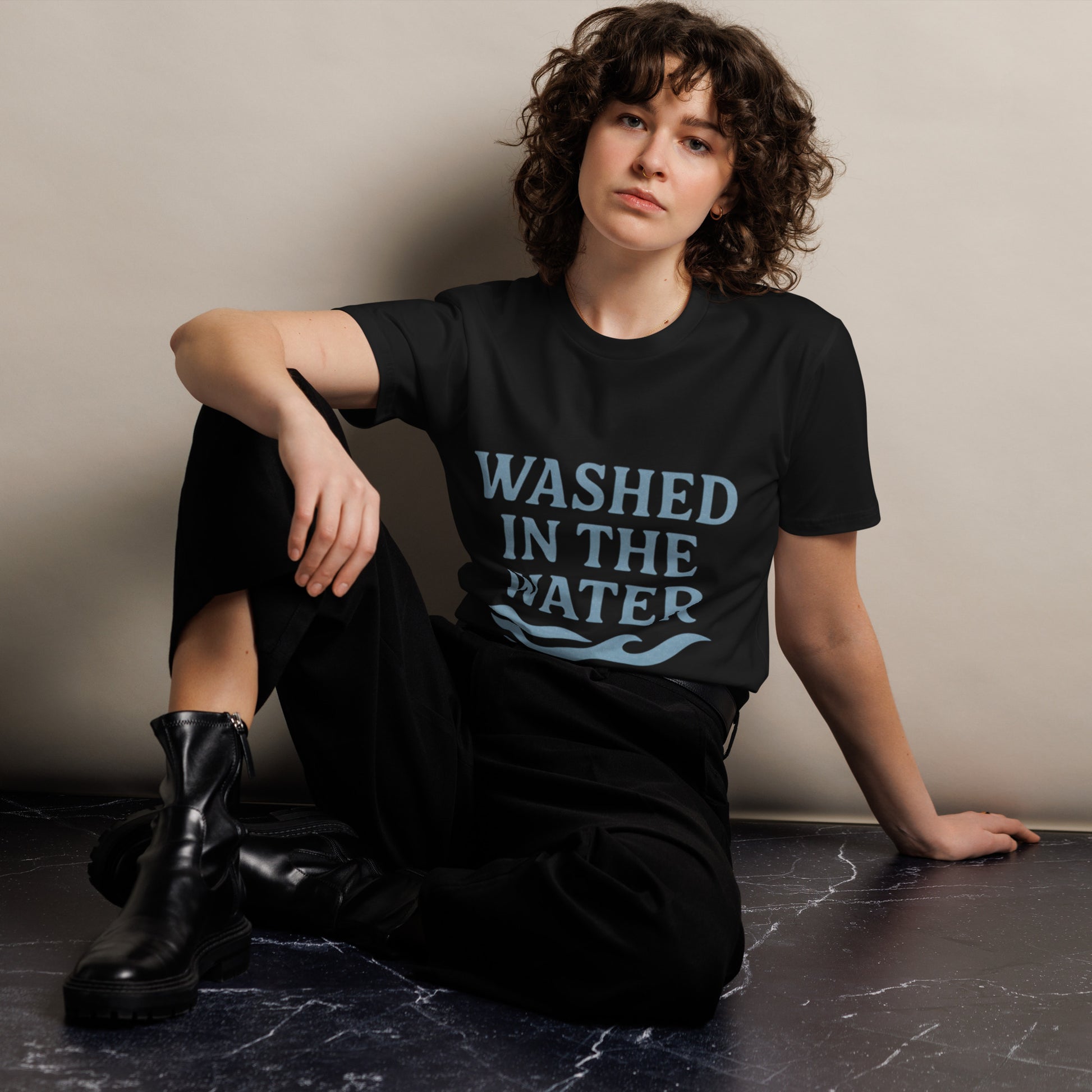 Unisex Christian graphic tee with the phrase “Washed in the Water.” Soft and durable faith-based shirt symbolizing baptism and new life in Christ. Perfect for church, baptisms, or everyday wear. Designed by Ever & Amen Co.