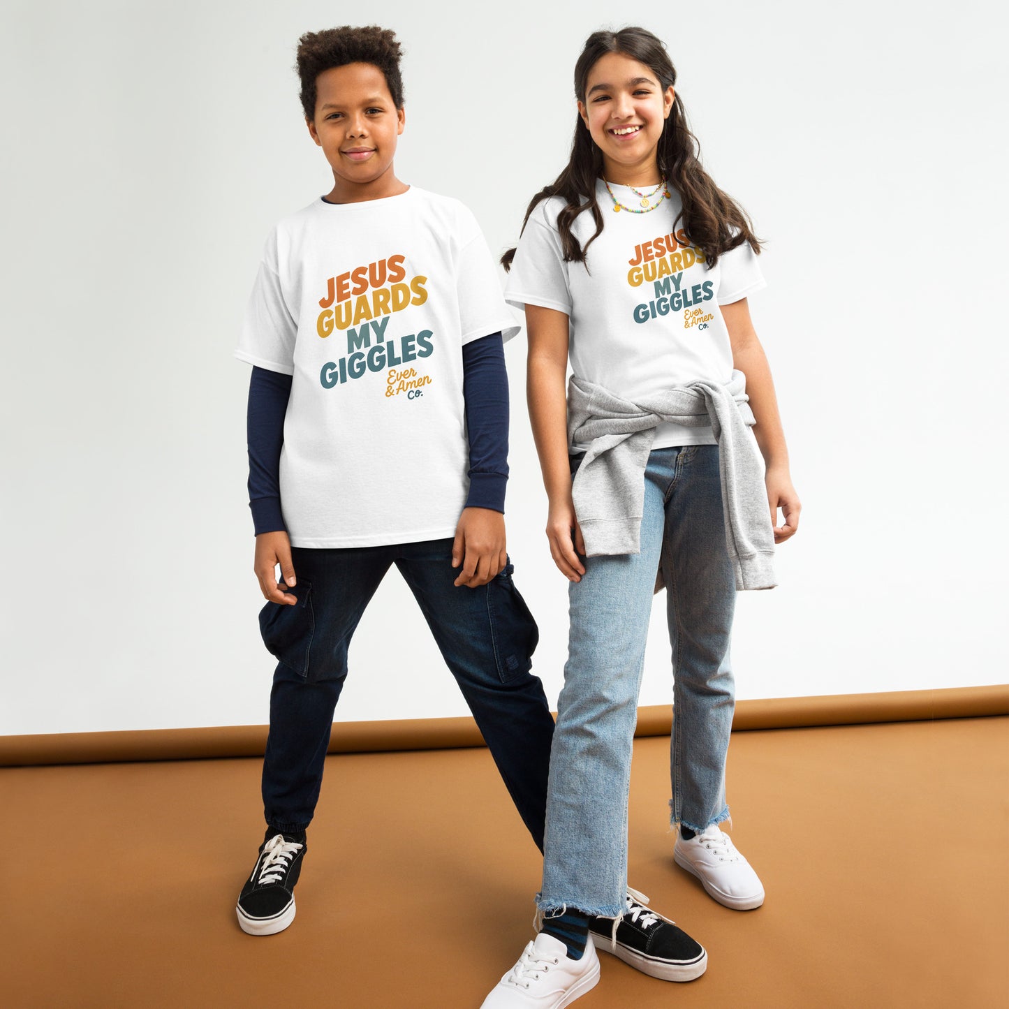 Children’s Christian graphic tee with the phrase “Jesus Guards My Giggles.” Fun and uplifting faith-based shirt reminding kids of God’s love and protection. Perfect for church, school, or everyday play. Created by Ever & Amen Co.